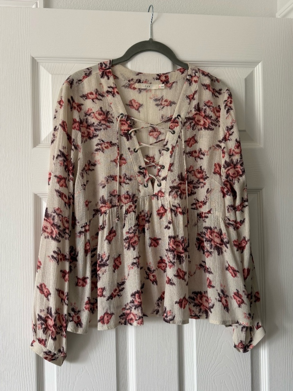 Lush Floral Blouse with Lace-Up Neckline